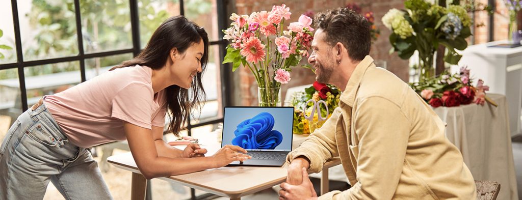 Two people collaborating at a computer