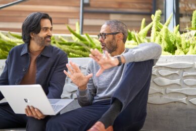 Colleagues collaborating in the courtyard.