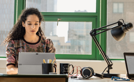 Person working on a computer at a desk