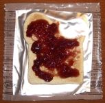 Grape jelly on wheat snack bread