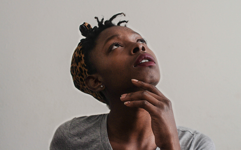 A woman looking upwards inquisitively.