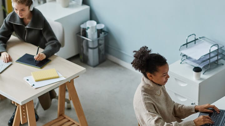 Two people working in an office