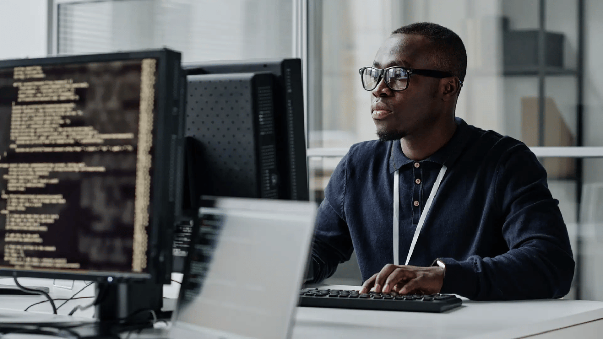 person with code on computer screen