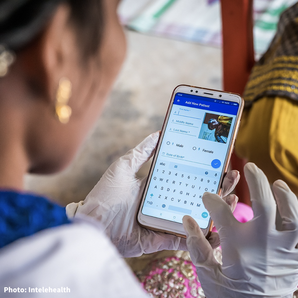 Hand typing on cell phone.