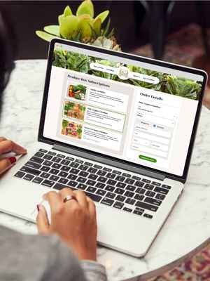 Close up of a woman hands over a laptop, browsing content in the web.