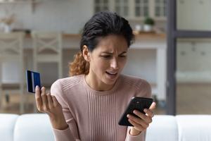 A woman distressed at an unsuccessful online payment