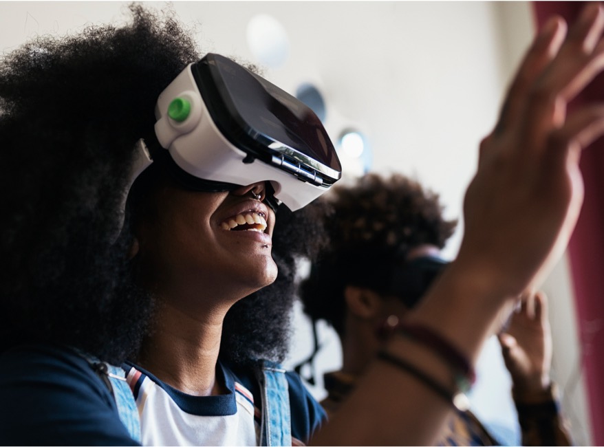 Happy woman with virtual reality glasses