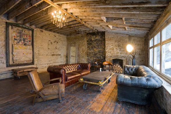 #raw #brick work walls, wooden #beamed ceiling and #leather #chesterfield #sofas from wwwshootfactory.co.uk