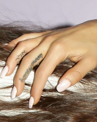 Ariana Grande Shows Off TWO New Finger Tattoos on Tour!