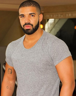 Drake’s Mysterious Arm Tattoo May be a Portrait of Rihanna