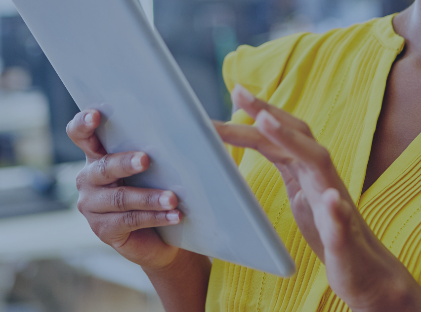 two hands holding a tablet