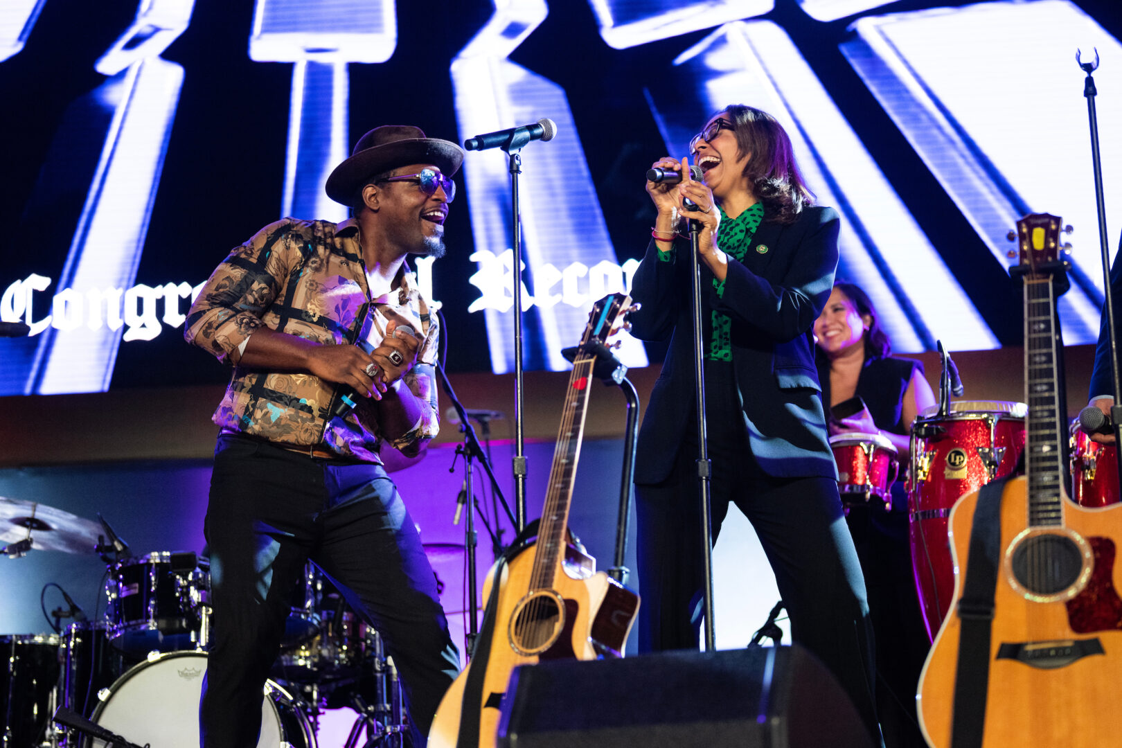 Wiley Brown, the son of go-go legend Chuck Brown, performs “Bustin’ Loose” with Rep. Sydney Kamlager-Dove, D-Calif., during the Congressional Record concert in the Capitol Visitor Center on Tuesday.