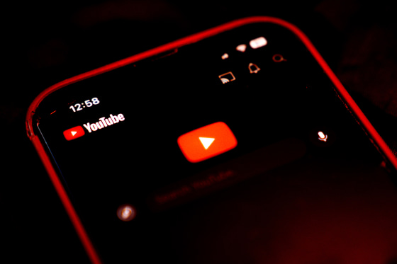 The logo for YouTube application arranged on a smartphone