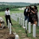 Victor Honey's family attends a burial service.