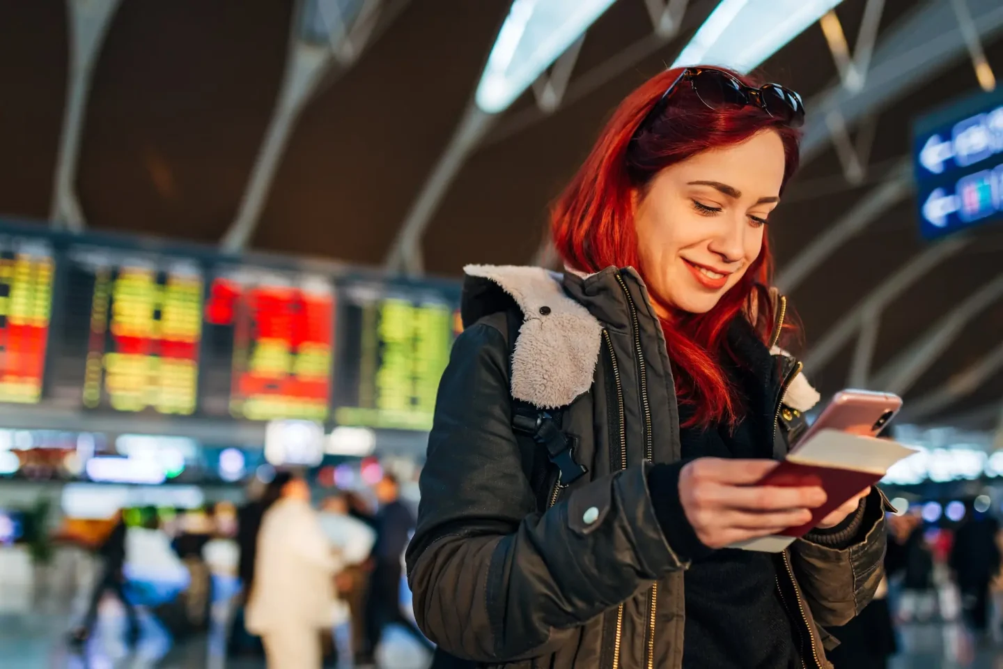 woman checking travel itinerary on mobile device