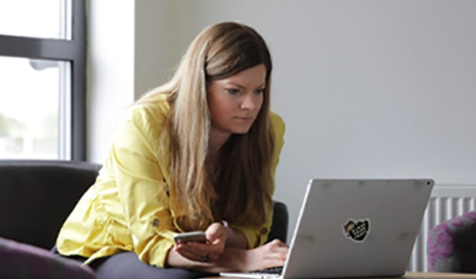 A woman working on a laptop