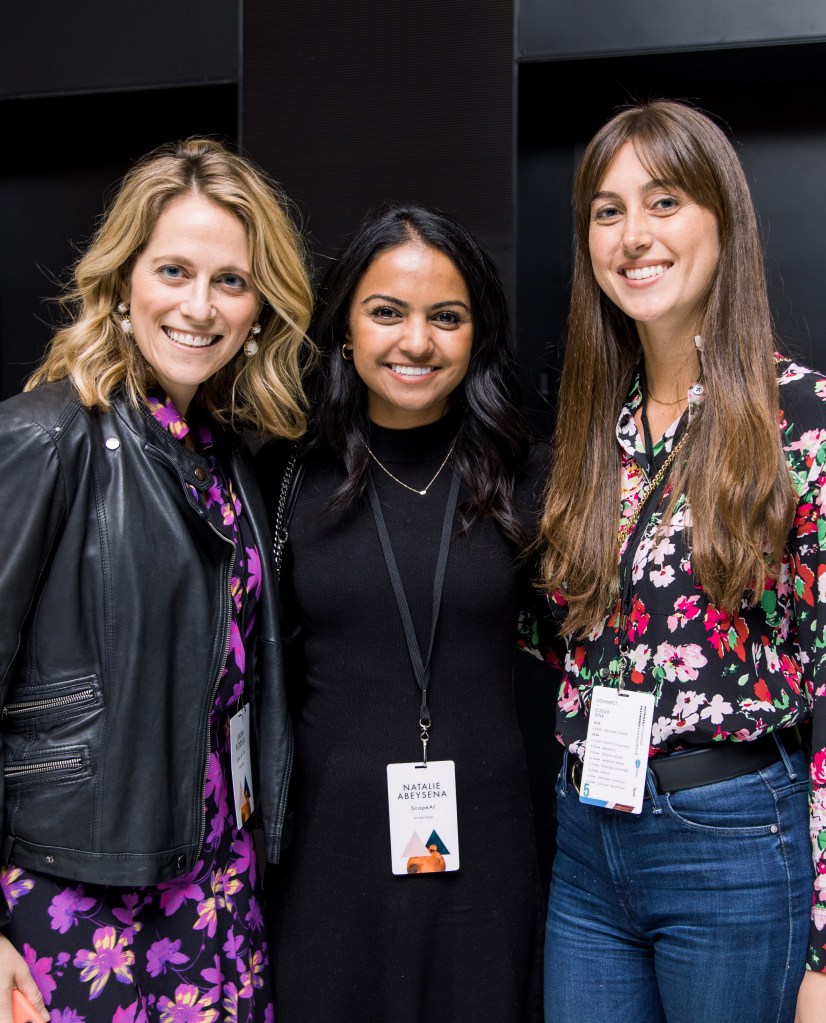 Members of the Salesforce team standing together smiling for a photo