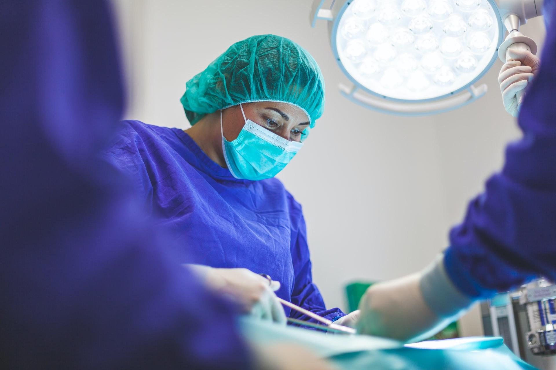 A medical professional in an operating theatre