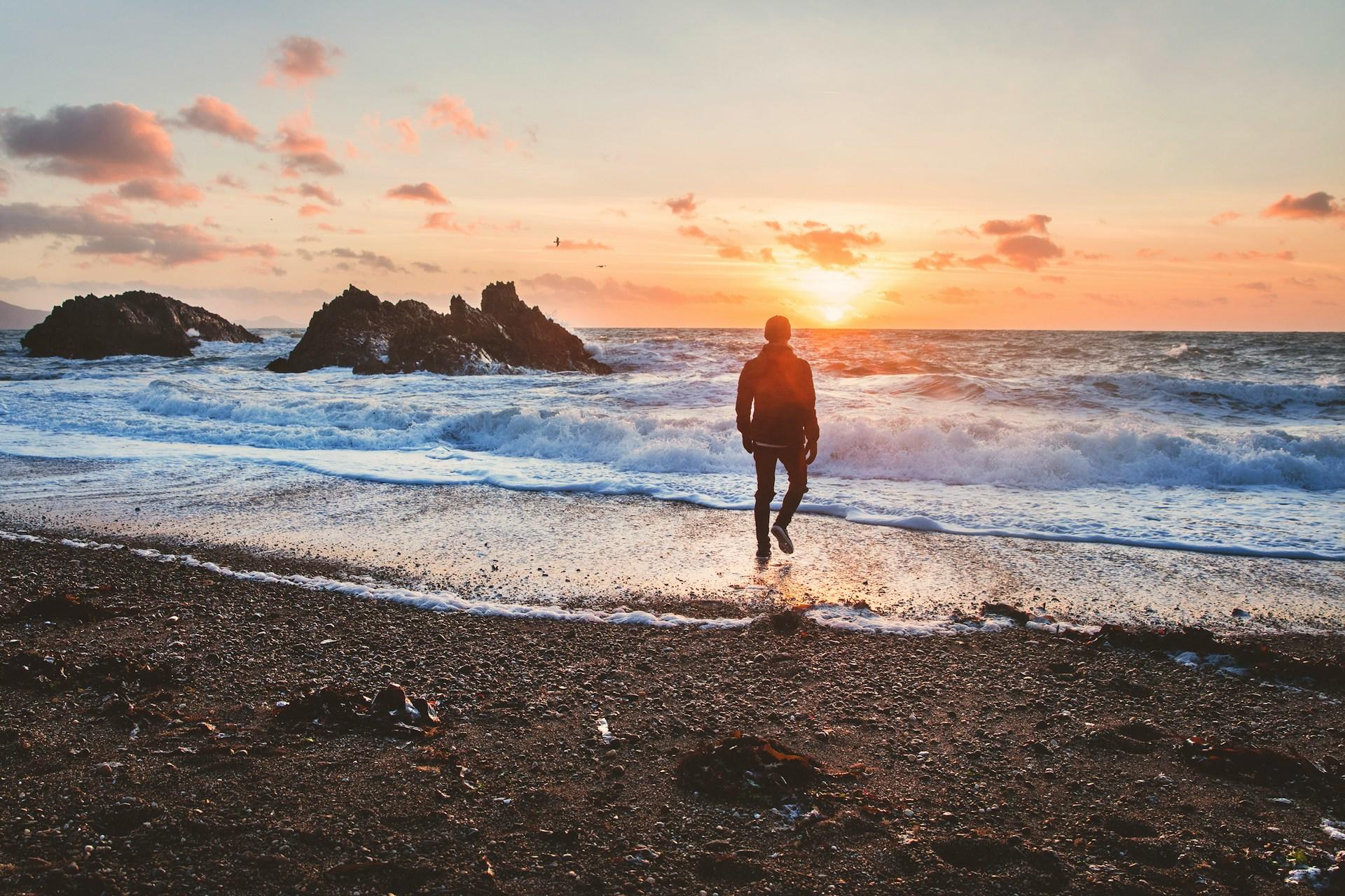 A man at a beach in Wales, UK.