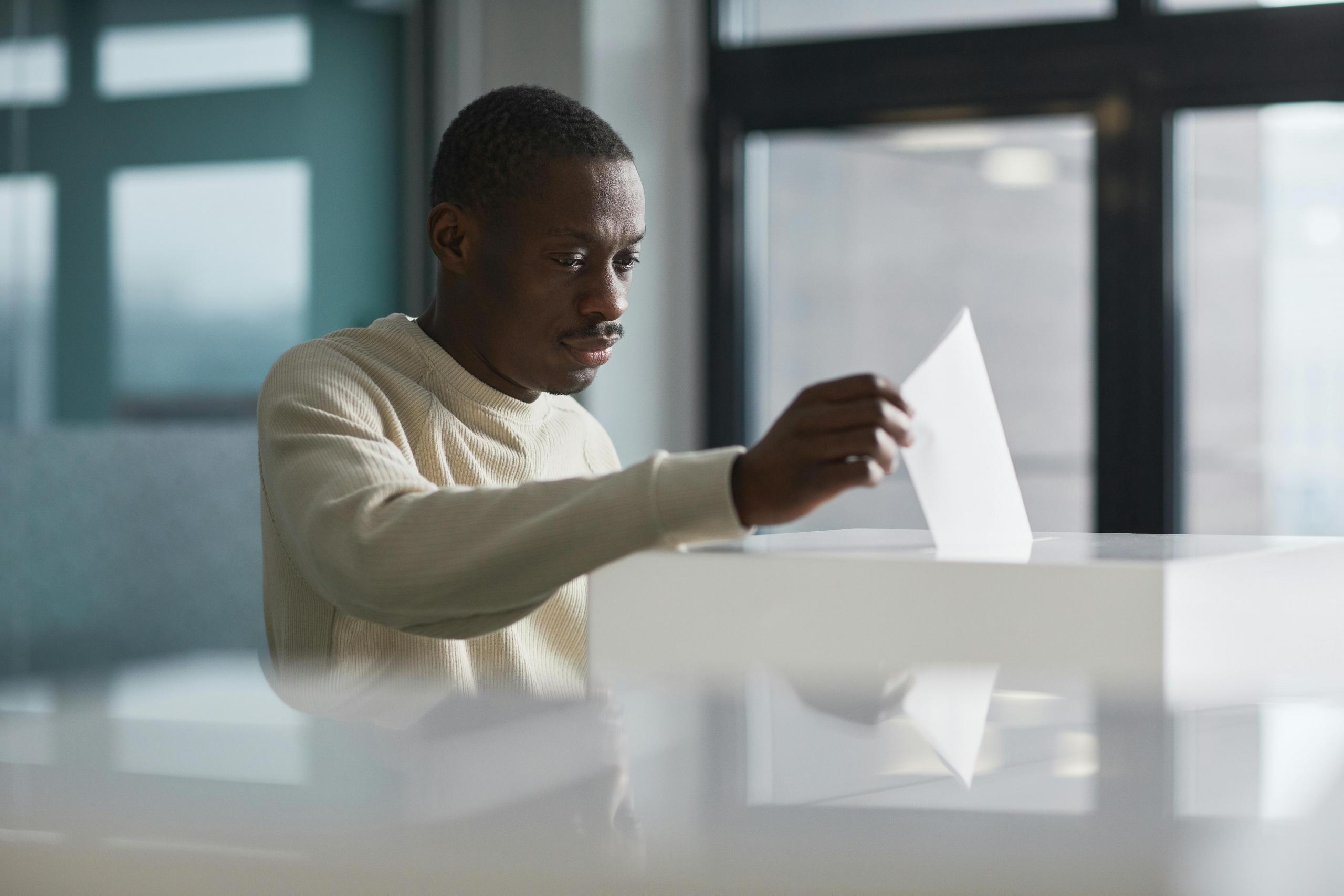 A man casting his vote in his local elections