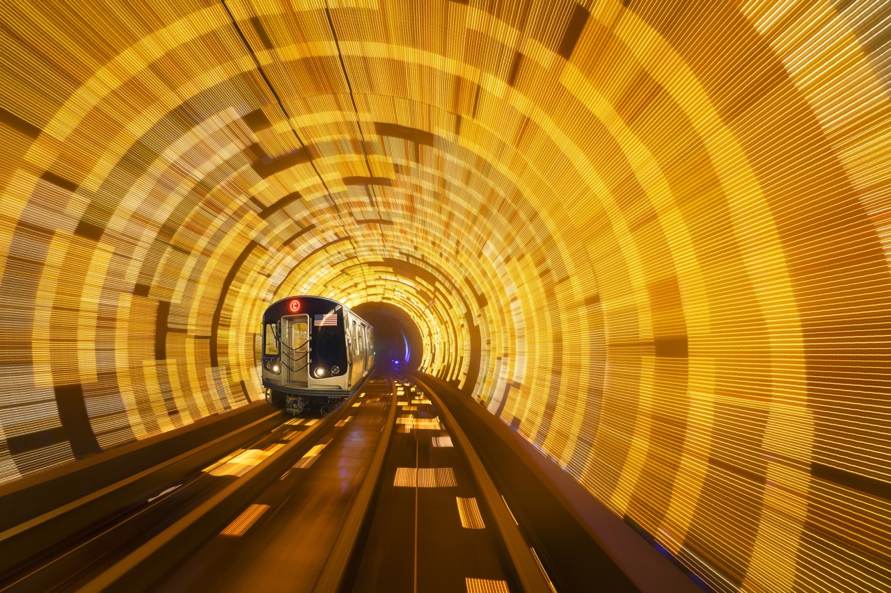 Subway Train in Motion at C Eighth Avenue Local. Speeding Train in New York City Subway Subway railroad tracks. Subway train passes in a motion blur tunnel at C Eighth Avenue Local. NYC, New York, USA (Photo: Juan Maria Coy Vergara/Getty Images)