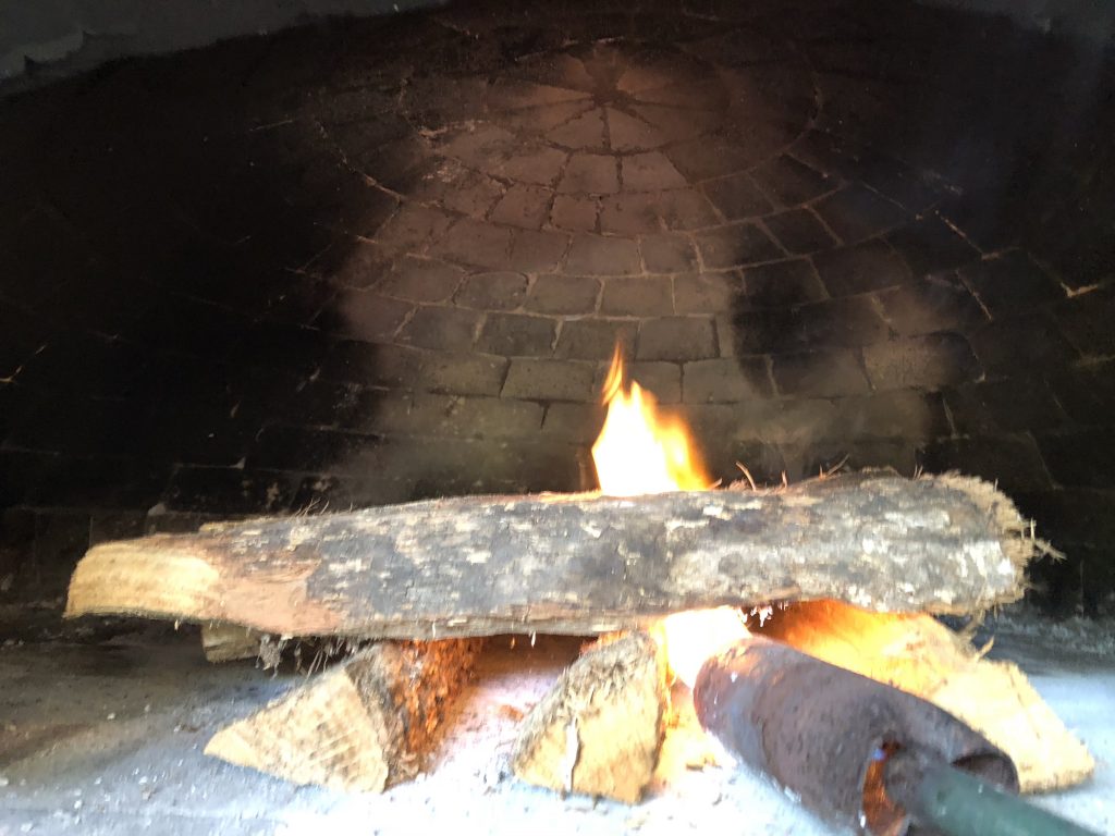 cure an oven by starting a very small fire