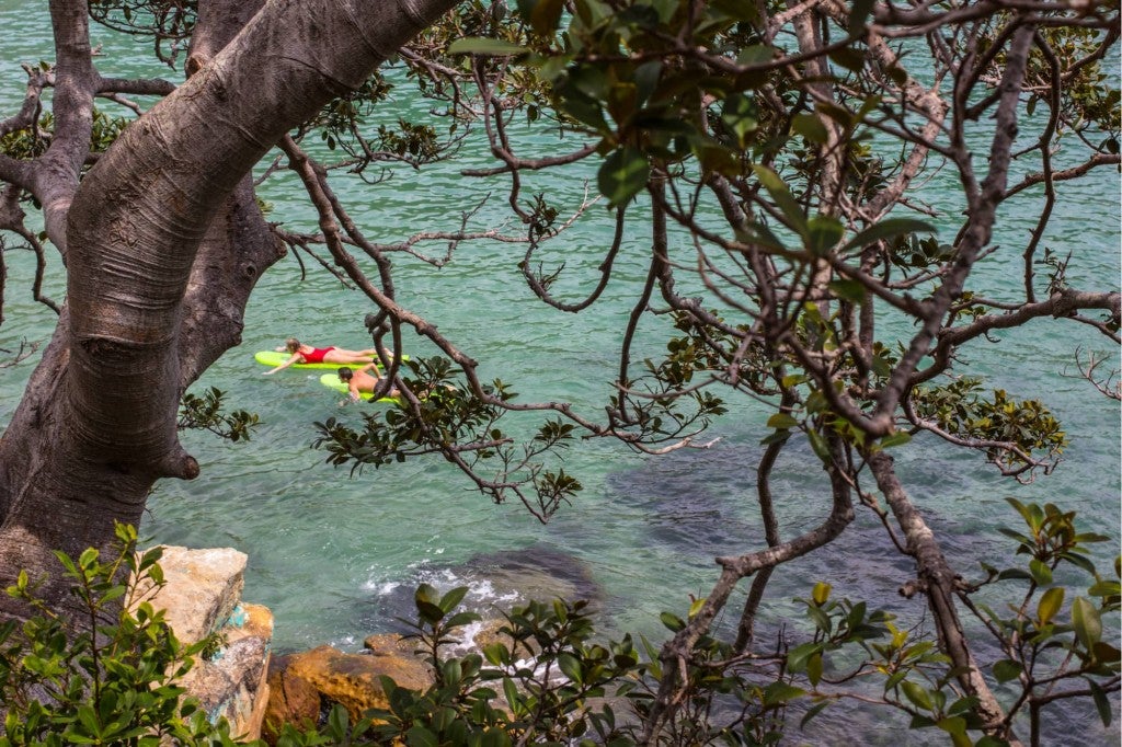 two people floating on the san marcos river