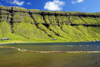 Kaldbaksfjørður fjord, Streymoy island, Faroes: green cliffs and floating nets, barrier used in sea farming - east coast of the island - photo by A.Ferrari