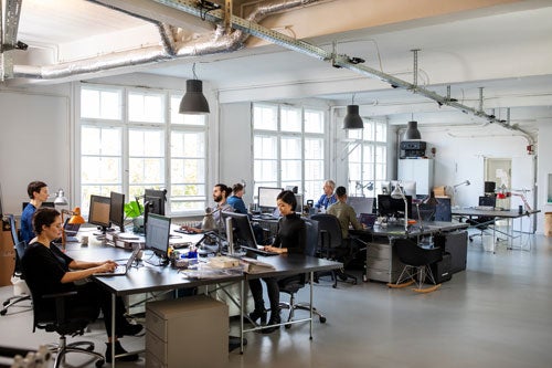 People working in an open air workspace