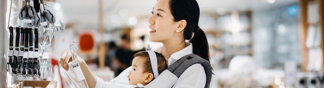 Asian women with baby shopping at department store