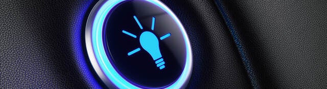 Image of a button with lightbulb icon glowing blue.