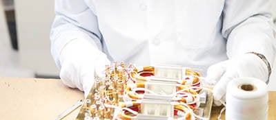 A UL laboratory worker examining a wire board. 