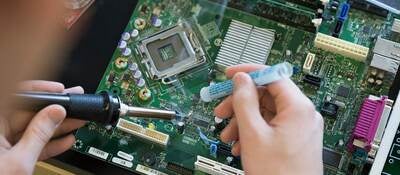 Person soldering a circuit board