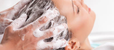 Woman’s hair being shampooed