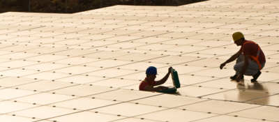 Workers installing solar panels