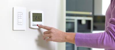 Woman changing heating.