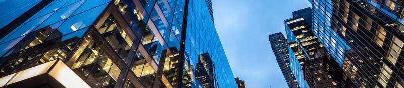  Skyscrapers at dusk, with lit offices