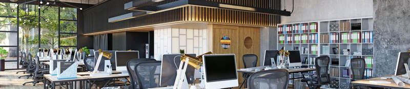 Row of empty desks in a modern office