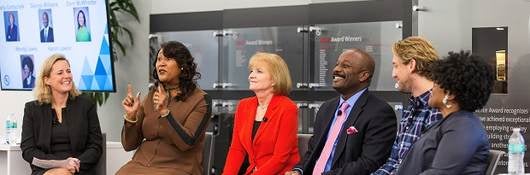 Panel picture of Gitte Schjotz,; Dorri McWhorter; Marla Gottschalk; George Williams; Aaron Lawlor; Wendy Lewis, Wearing a red jacket, Marla Gottschalk speaks before the crowd, UL employee asks question of panel, , 