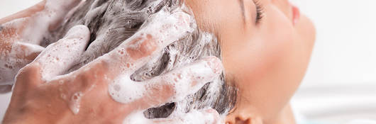 Woman’s hair being shampooed