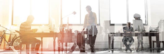 Black and white photo of people in an office