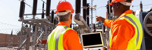 power workers on laptop