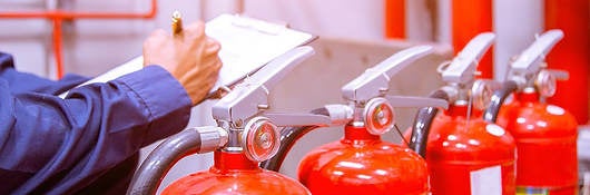 Photo of Engineer checking Industrial fire control system