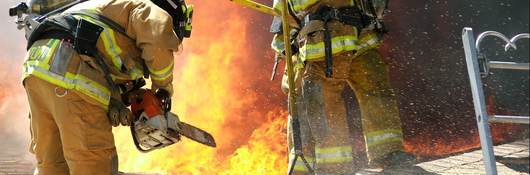 Firefighters working on roof