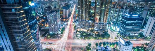 High Angle View Of Cityscape Lit Up At Night