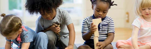 Children playing with wood blocks