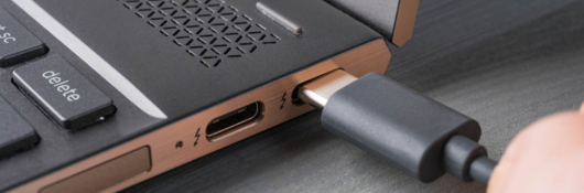 Closeup of a Thunderbolt plug in a laptop