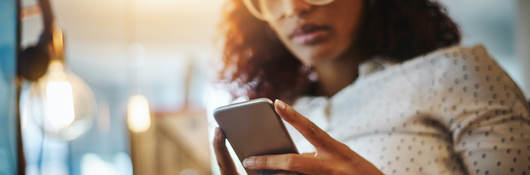 woman looking at a mobile phone