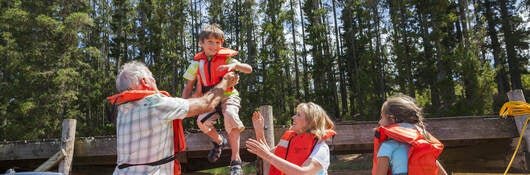 A family going boating wearing life vests