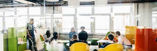 Young business professionals sitting on modern furniture